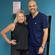 woman posing smiling with a doctor
