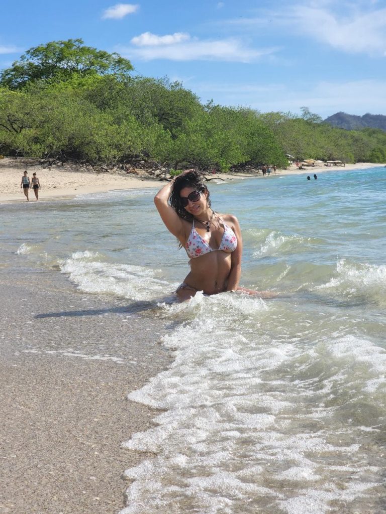 woman posing in bikini at the beach