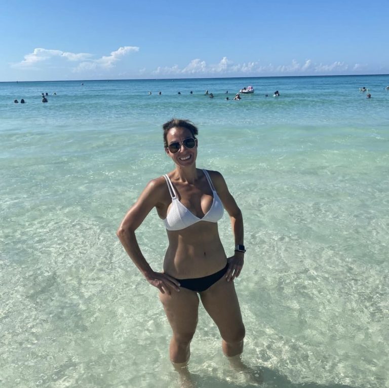woman posing in bikini at the beach