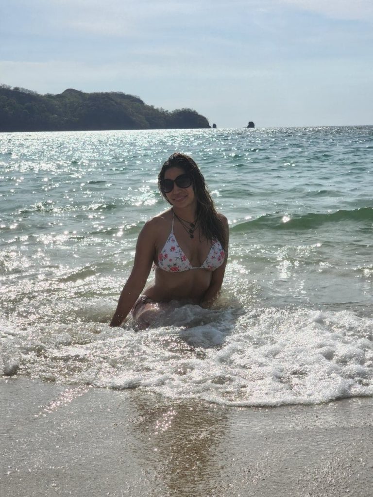 woman posing at the beach